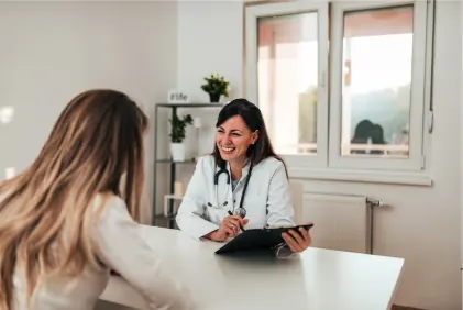 A physician reviewing autoimmune blood results with a patient