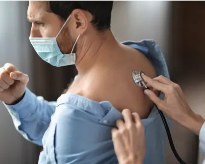 A patient undergoing a breathing capacity test