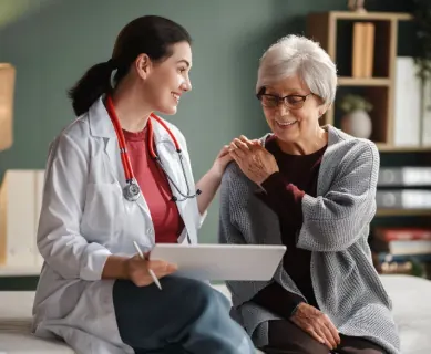Doctor consulting with an elderly patient at Bangkok Mediplex
